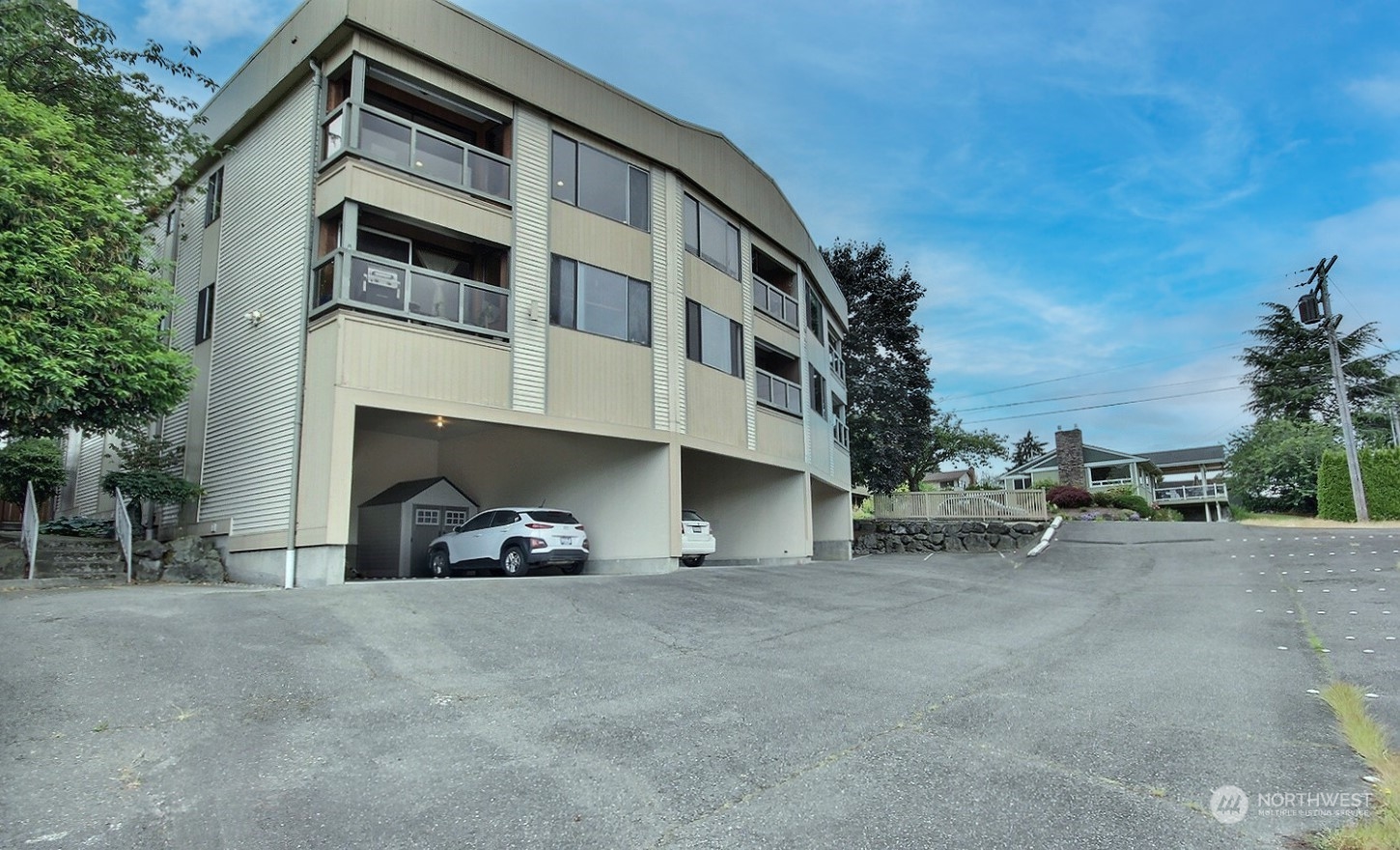 740 North 32nd Street, Unit 1 Renton, WA 98056 - Photo 29 of 32 a view of a car park with large trees