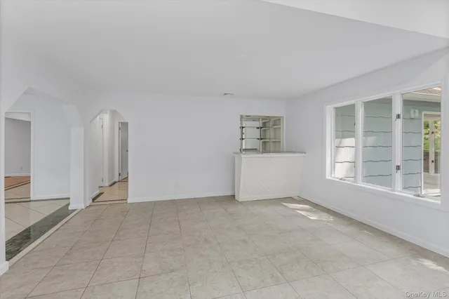 a bathroom with a granite countertop toilet sink and a mirror