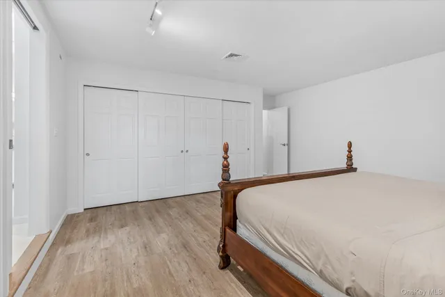 a kitchen with granite countertop sink and cabinets