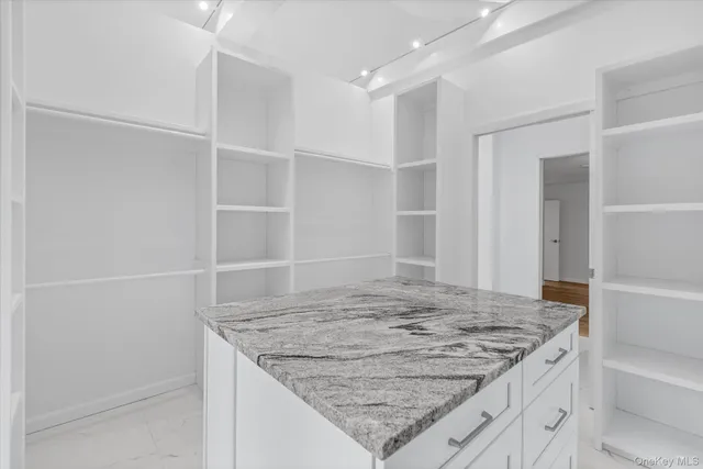 a bathroom with a bathtub and window