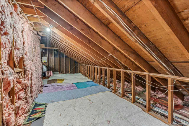 a yellow house with trees in front of it