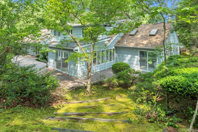 a view of a lake with lawn chairs