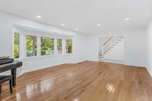 a view of a kitchen with wooden floor and a sink