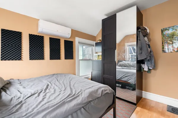 a bedroom with a bed and a cabinets