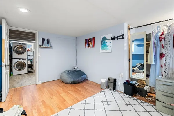a bedroom with a bed and walk in closet