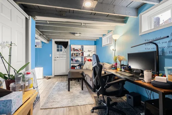 a workspace with furniture and a potted plant