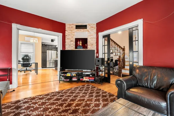 a living room with furniture and a flat screen tv