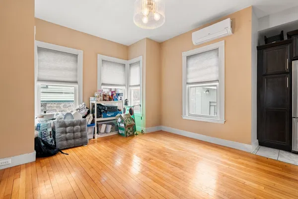 a bedroom with furniture and a window