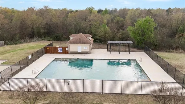 a view of swimming pool with a yard