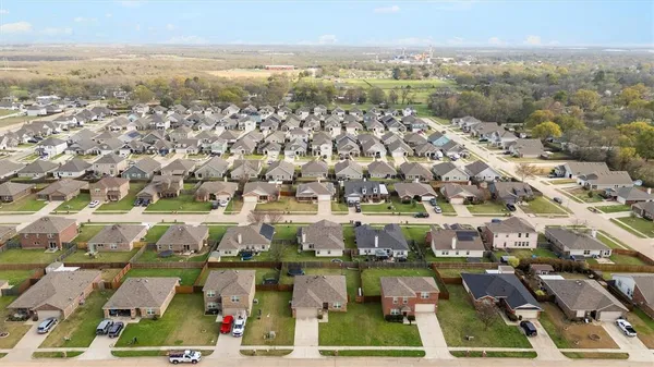an aerial view of residential houses with outdoor space