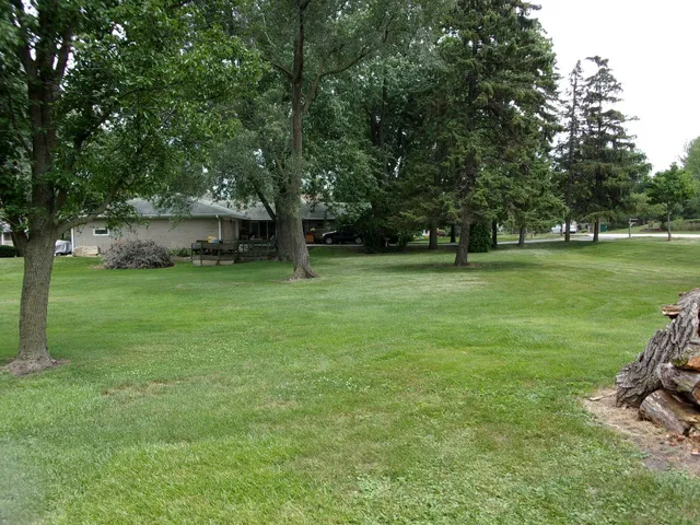 a backyard of a house with lots of green space