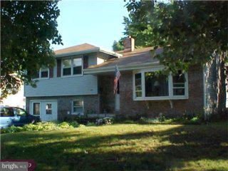 206 Cambridge Road Cherry Hill, NJ 08034 - Photo 1 of 6 a front view of a house with a yard and garage