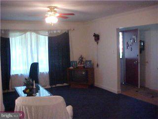 206 Cambridge Road Cherry Hill, NJ 08034 - Photo 4 of 6 a living room with furniture and a chandelier