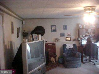206 Cambridge Road Cherry Hill, NJ 08034 - Photo 5 of 6 a living room with furniture and a fireplace