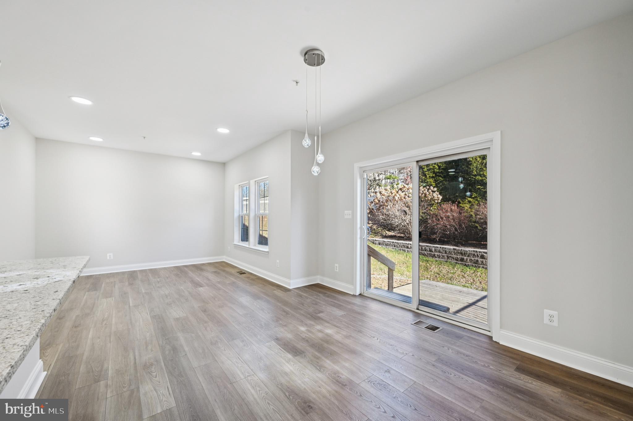 6305 Winters Lane Hanover, MD 21076 - Photo 20 of 83 an empty room with wooden floor and a window