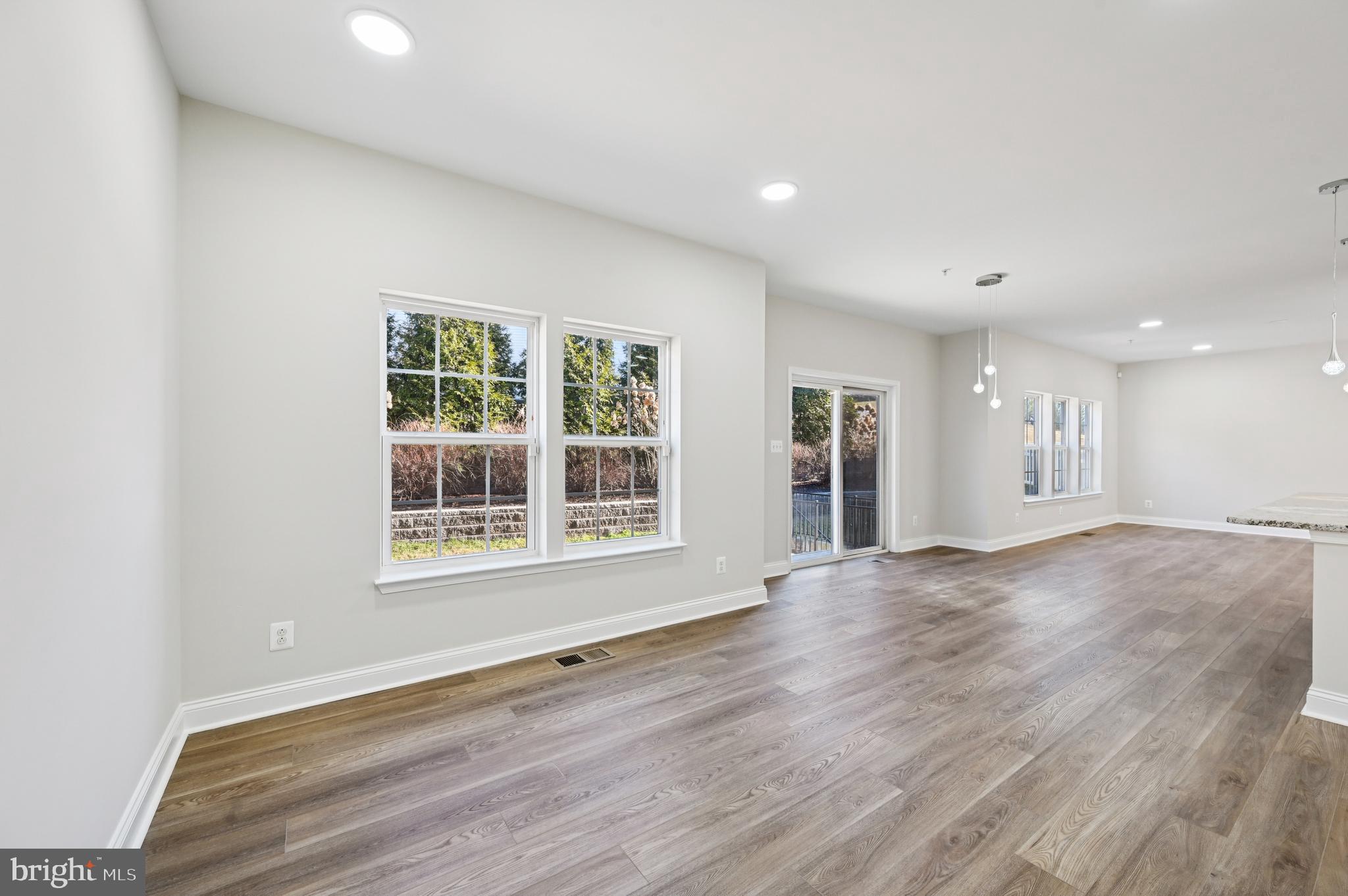 6305 Winters Lane Hanover, MD 21076 - Photo 25 of 83 an empty room with wooden floor and windows