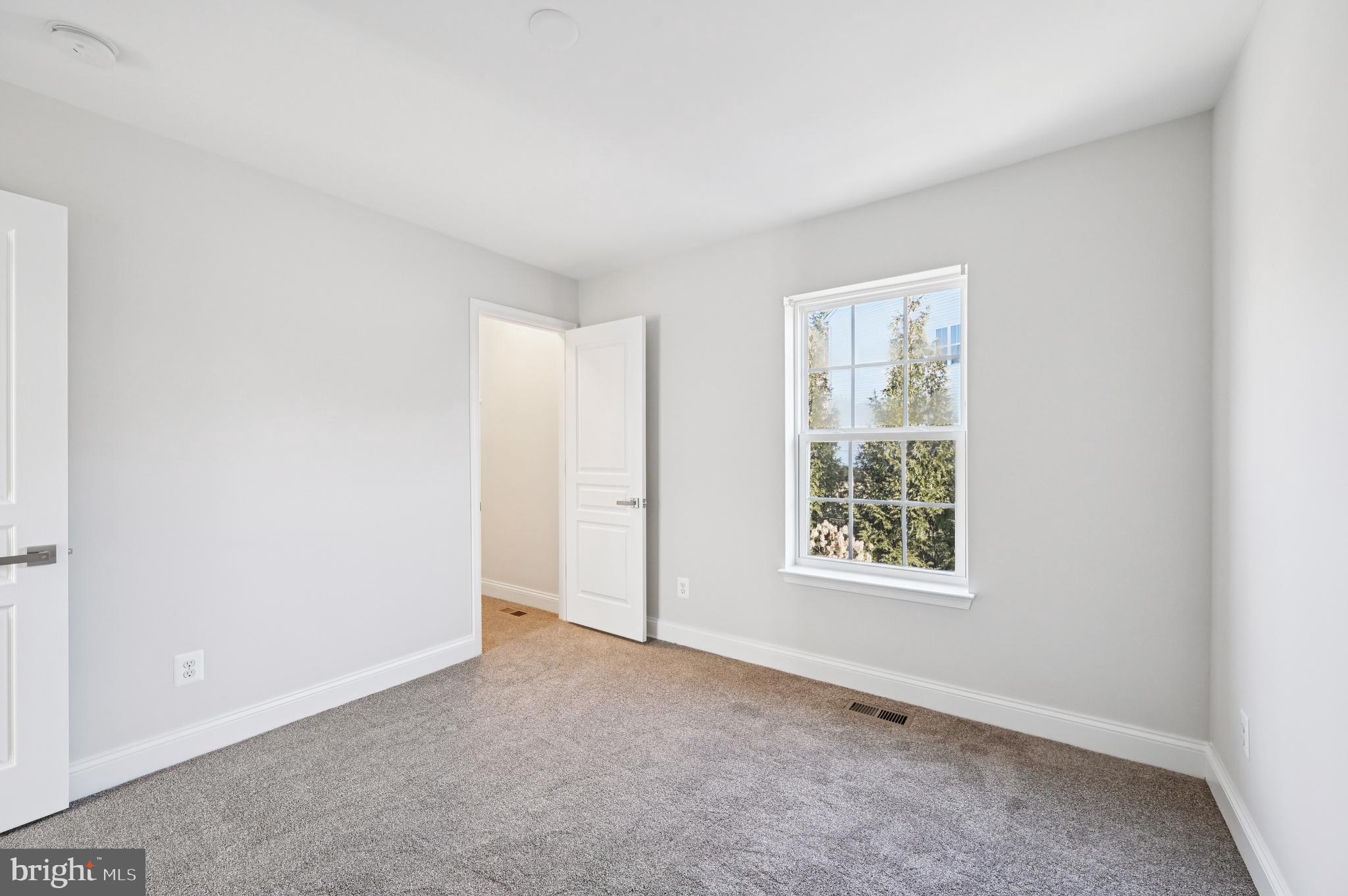 6305 Winters Lane Hanover, MD 21076 - Photo 39 of 83 an empty room with windows and closet