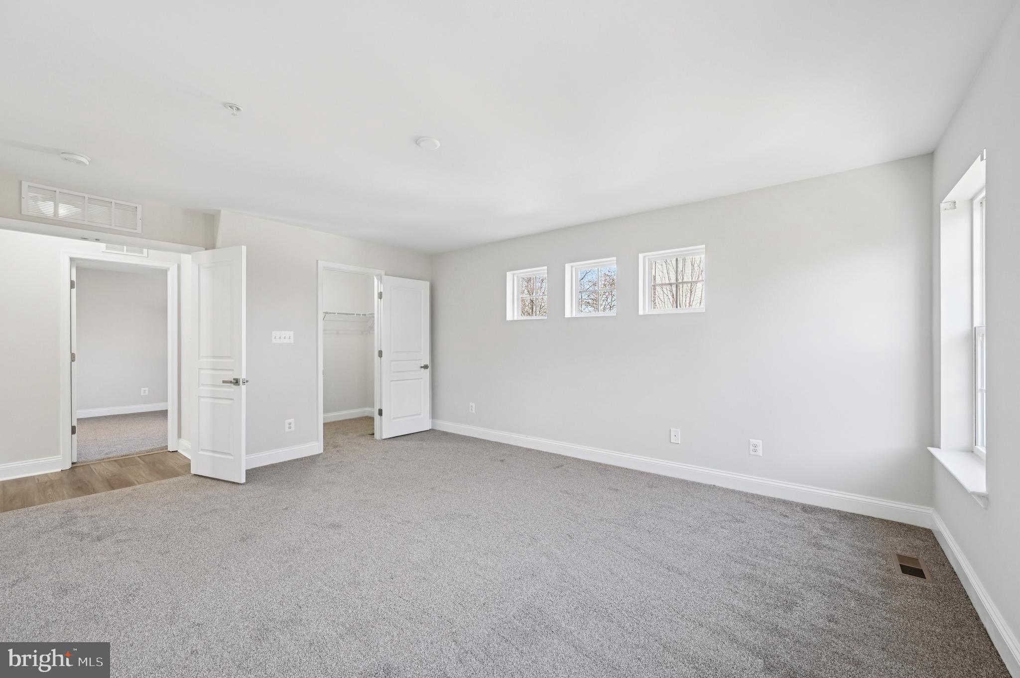 6305 Winters Lane Hanover, MD 21076 - Photo 49 of 83 an empty room with a empty space and windows