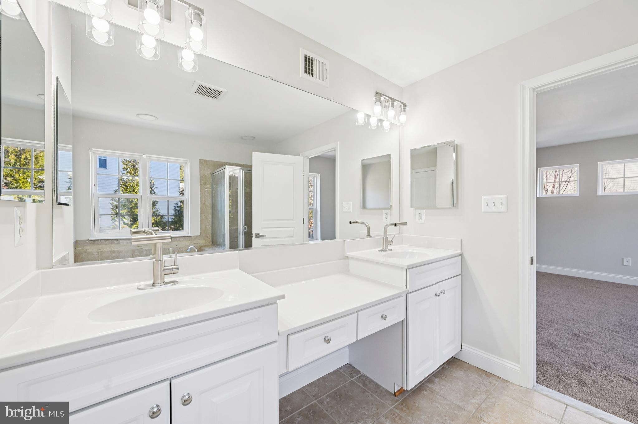 6305 Winters Lane Hanover, MD 21076 - Photo 51 of 83 a bathroom with a sink double vanity and a mirror