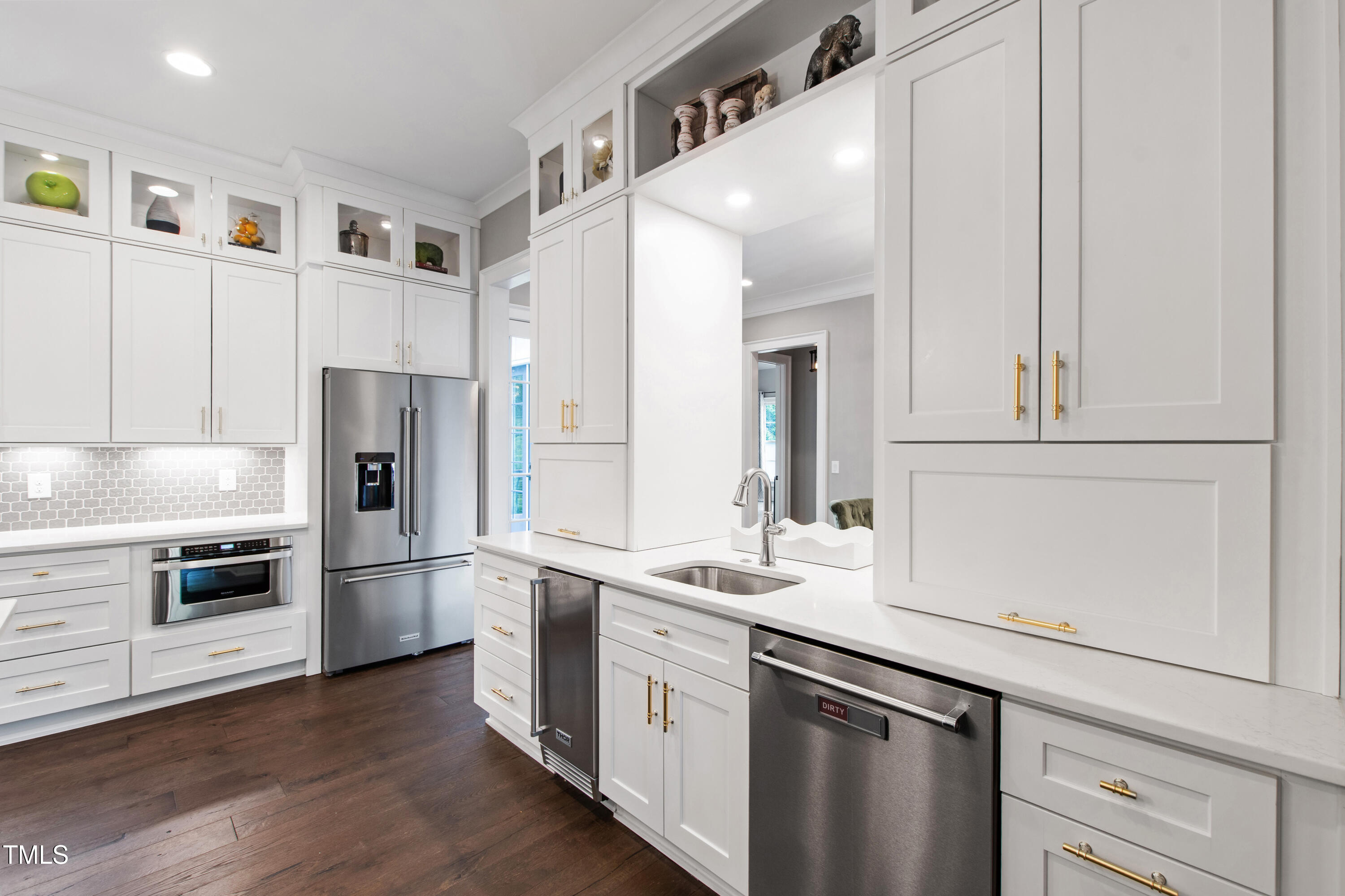 4237 Rowan Street Raleigh, NC 27609 - Photo 13 of 34 a kitchen with a refrigerator and a sink