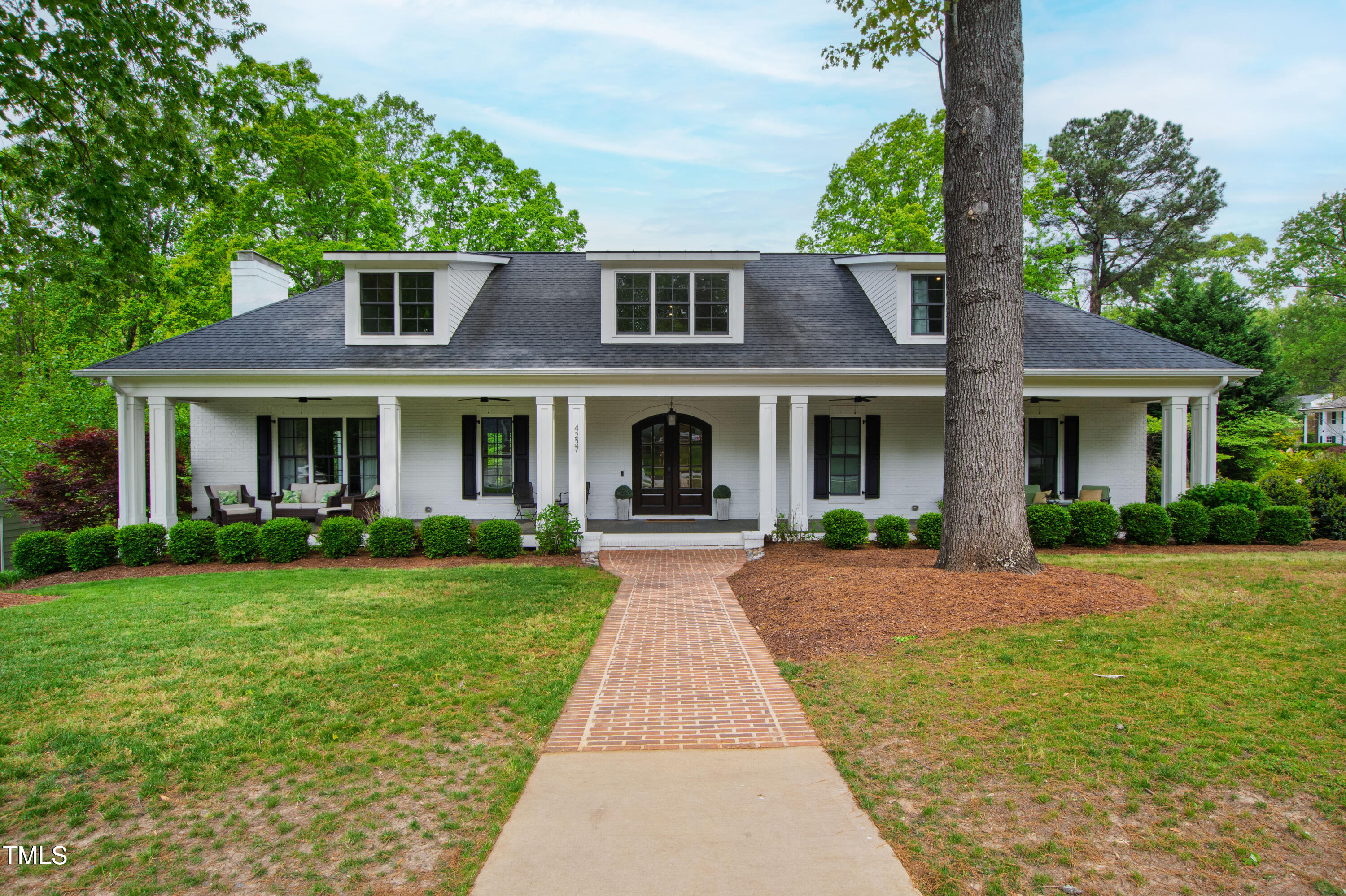 4237 Rowan Street Raleigh, NC 27609 - Photo 2 of 34 a front view of a house with yard and green space