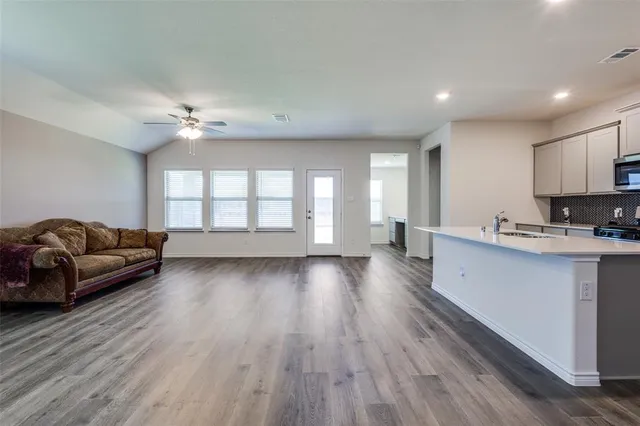 an outdoor space with furniture and a lake view