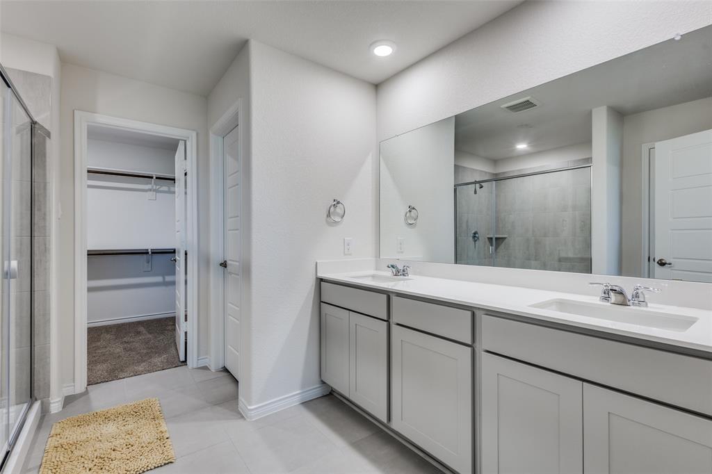 6213 Abby Drive Aubrey, TX 76227 - Photo 14 of 32 a bathroom with a double vanity sink mirror and double