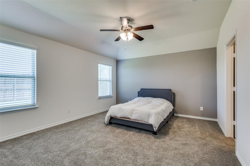 6213 Abby Drive Aubrey, TX 76227 - Photo 15 of 32 a bedroom with a bed and window