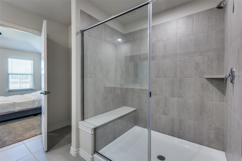 6213 Abby Drive Aubrey, TX 76227 - Photo 16 of 32 a bathroom with a shower and toilet
