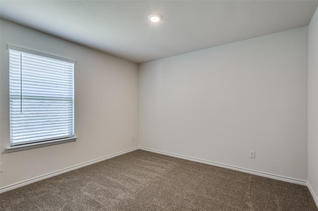 6213 Abby Drive Aubrey, TX 76227 - Photo 21 of 32 an empty room with a window