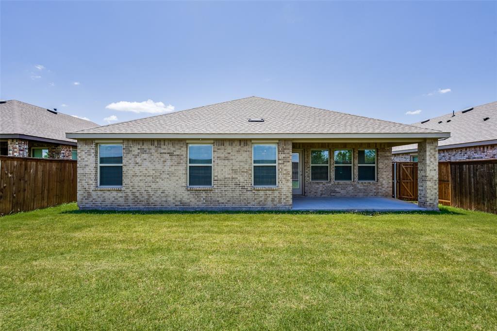 6213 Abby Drive Aubrey, TX 76227 - Photo 22 of 32 a view of a house with a garden