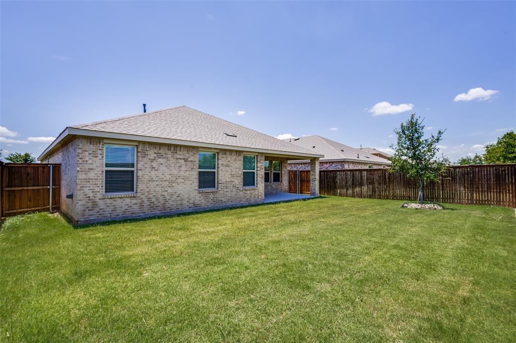 6213 Abby Drive Aubrey, TX 76227 - Photo 23 of 32 a front view of a house with garden