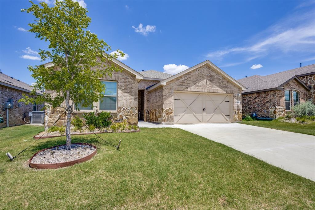 6213 Abby Drive Aubrey, TX 76227 - Photo 28 of 32 a view of a house with a yard and garage
