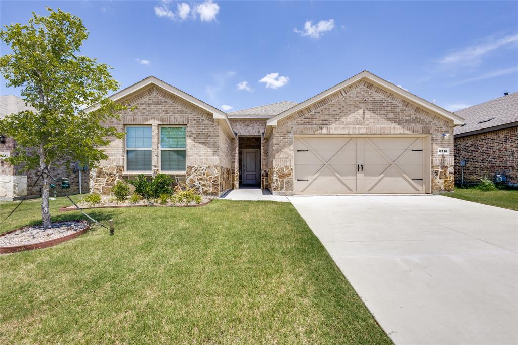 6213 Abby Drive Aubrey, TX 76227 - Photo 3 of 32 a front view of a house with garden