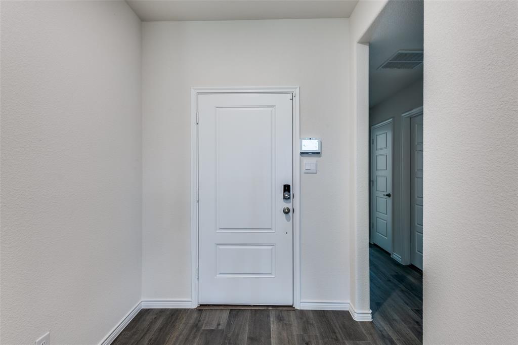 6213 Abby Drive Aubrey, TX 76227 - Photo 6 of 32 an empty room with wooden floor