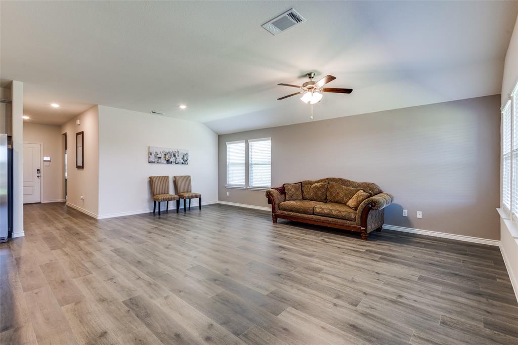 6213 Abby Drive Aubrey, TX 76227 - Photo 8 of 32 a living room with furniture and a ceiling fan