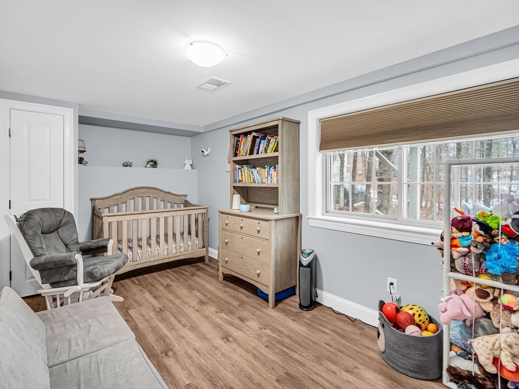 25 Indian Road Groton, MA 01450 - Photo 11 of 25 a bedroom with furniture and a wooden floor