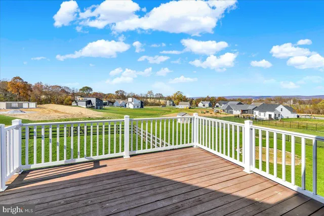 a view of a deck with sunset view