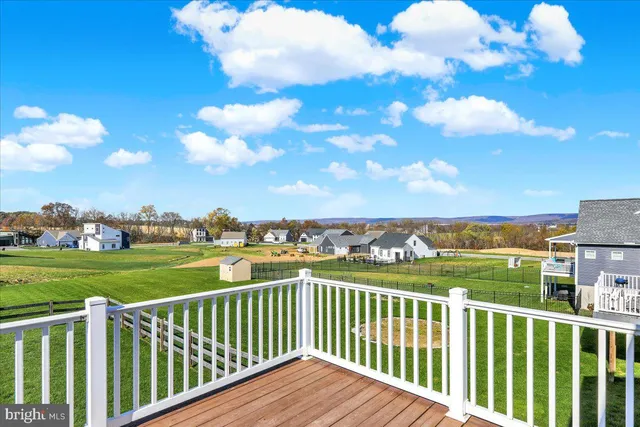 a view of a balcony with wooden fence
