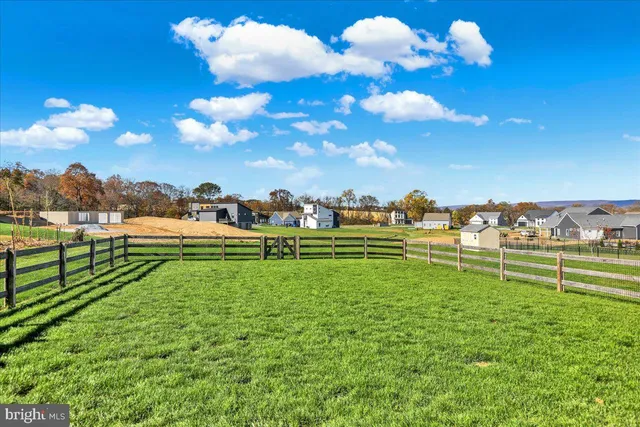 a view of a golf course with chairs