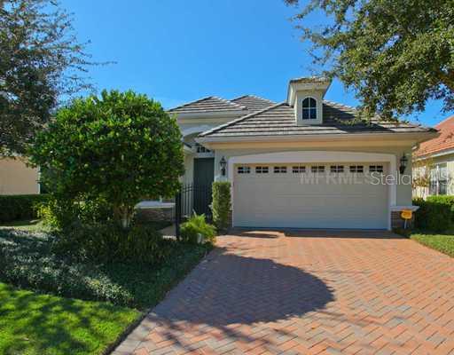 7616 Windward Cove Lakewood Ranch, FL 34202 - Photo 1 of 1 a front view of a house with a yard and garage