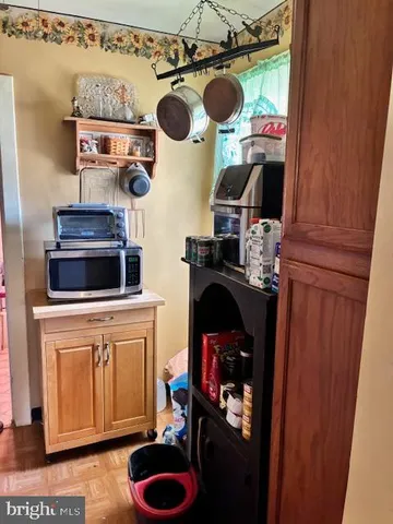 a kitchen with a stove and a wooden cabinets