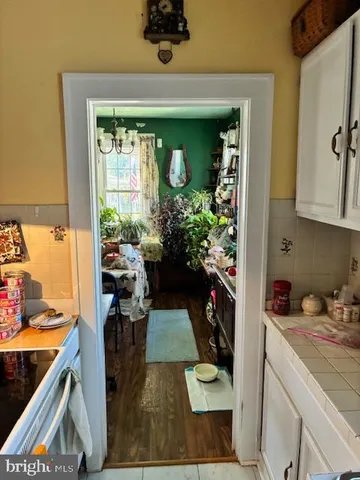 a kitchen with a sink and a stove top oven