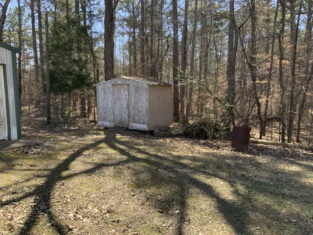 a bed sitting in a room next to a window