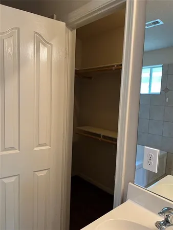 a view of hallway with wooden floor