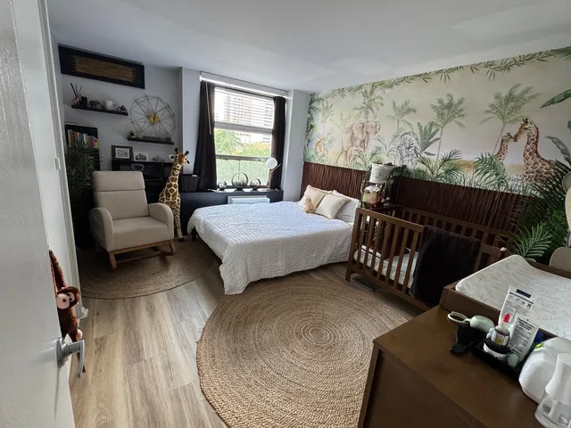 a bedroom with furniture and a window