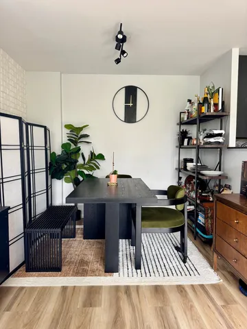 a living room with furniture lamp and rug