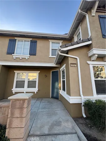 a front view of a house with a garage