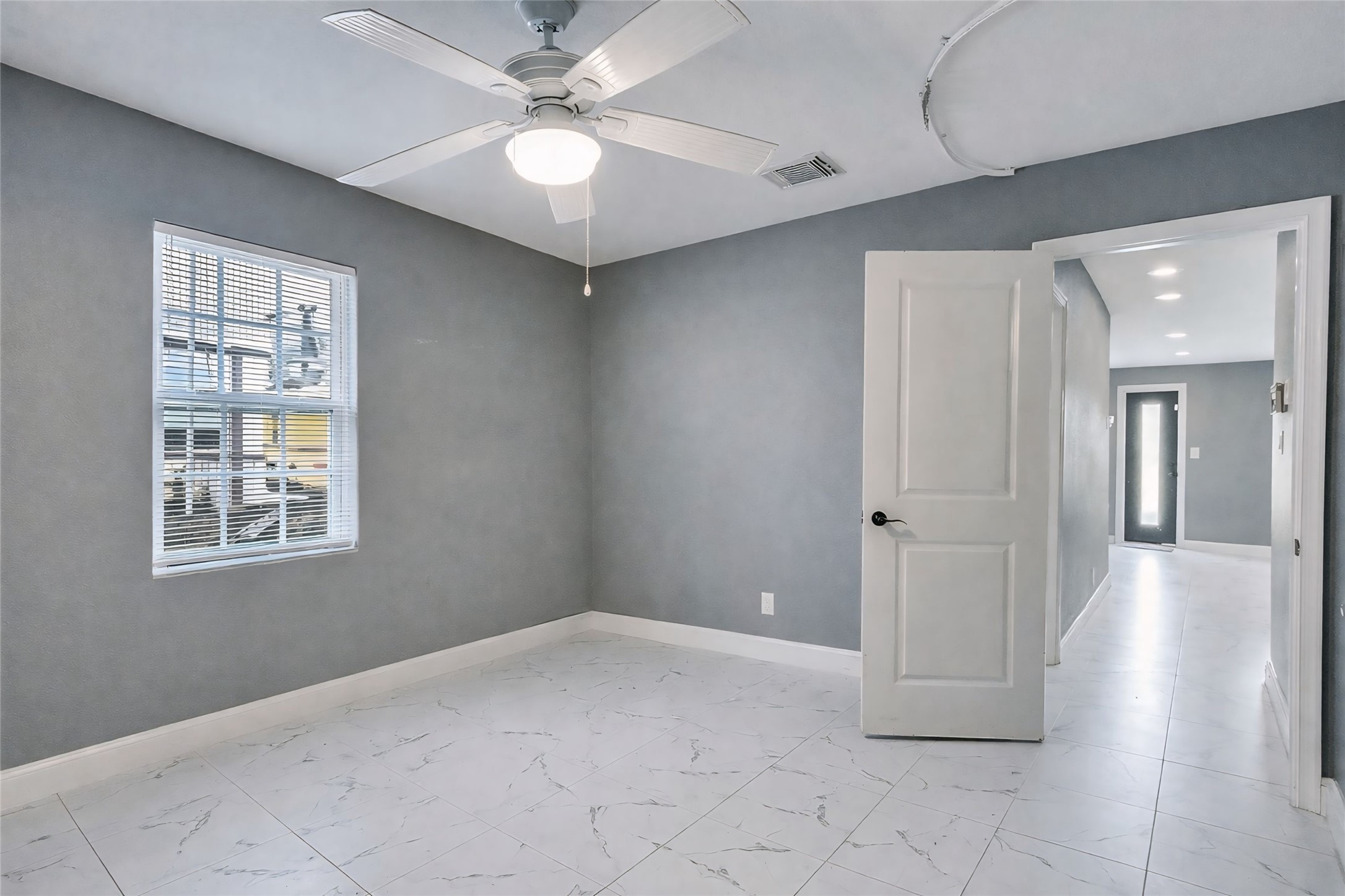 1107 East 40th 1/2 Street Houston, TX 77022 - Photo 14 of 15 a view of an empty room with a window