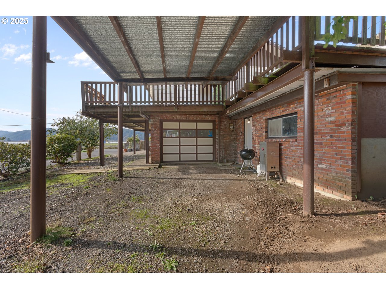 205 Marsh Street Gardiner, OR 97441 - Photo 11 of 46 a view of an house with a porch